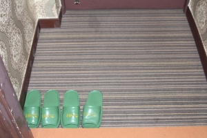 Picture of slipers in hotel room